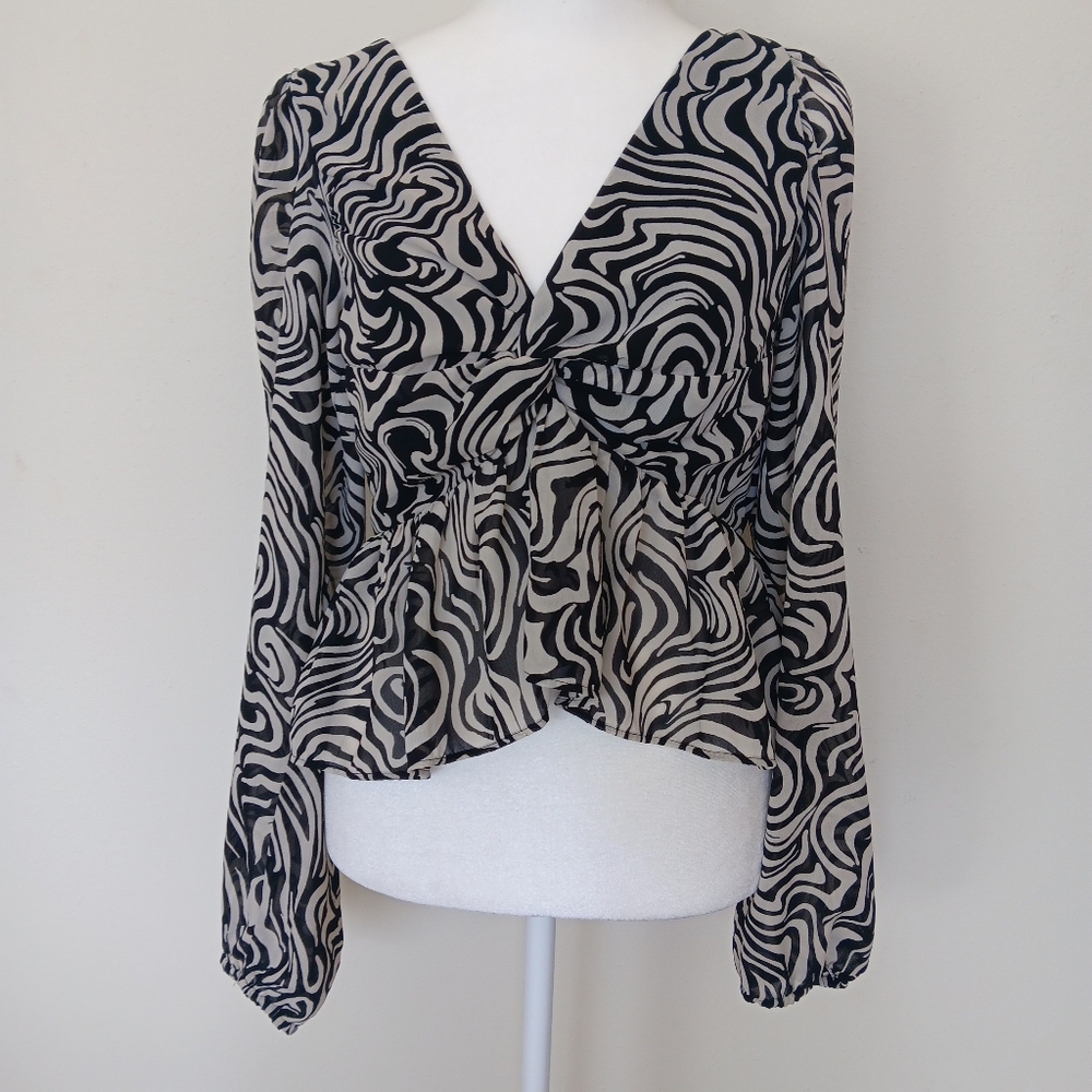 futuristic swirly cropped long sleeve blouse